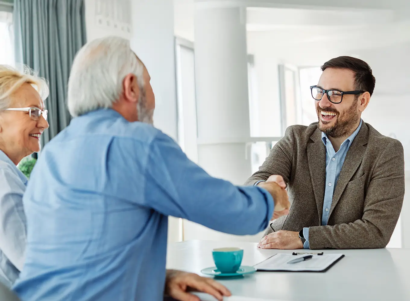 a senior couple talking to an insurance advisor about their Medicare options. - Springfield, IL